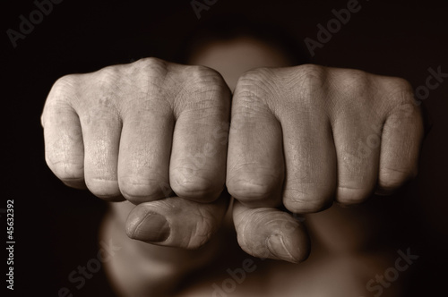 Two human fists as a symbol of aggression.