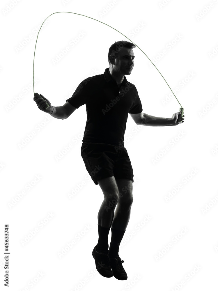 Obraz premium man exercising jumping rope silhouette