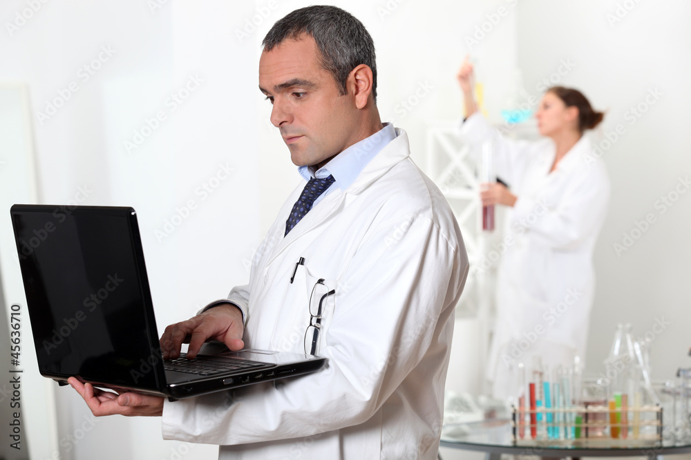 Scientists working in a lab Scientists working in a lab