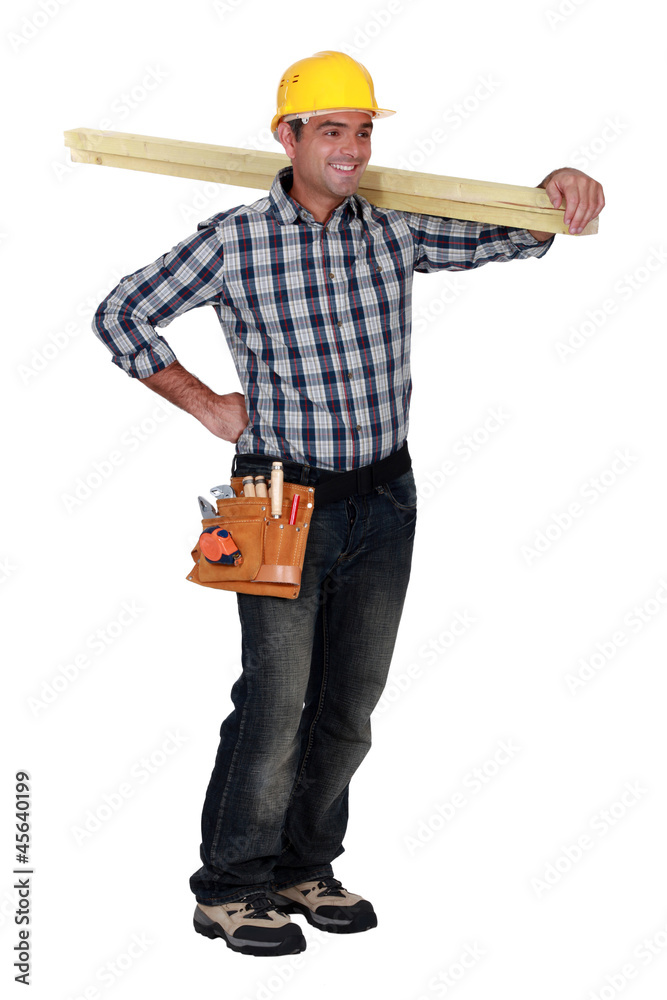 Happy carpenter standing on white background Happy carpenter standing on white background