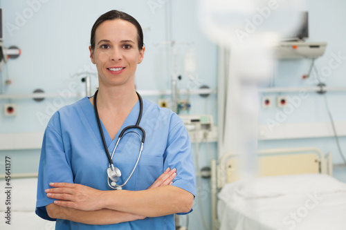 Smiling nurse in hospital ward