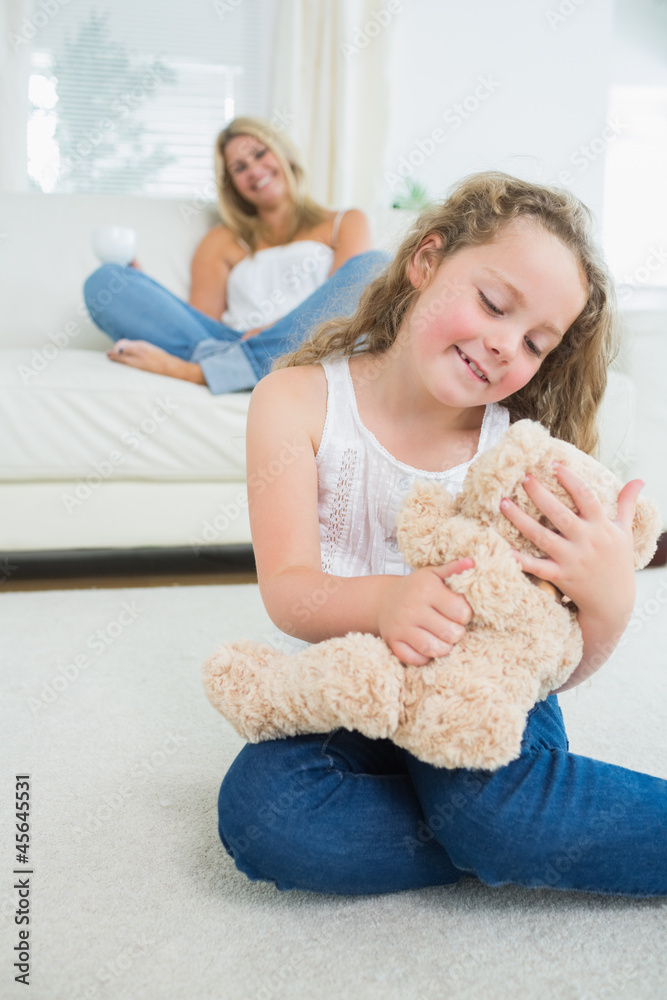 Smiling daughter with her teddy Smiling daughter with her teddy