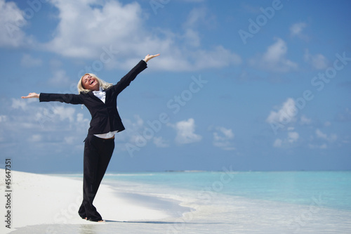 happy business woman on the ocean coast