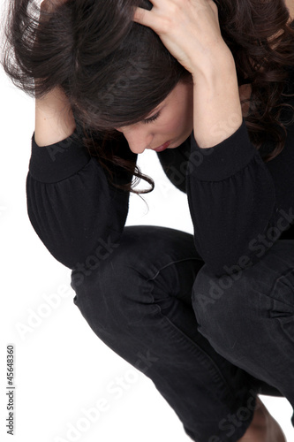 Sad woman squatting © auremar