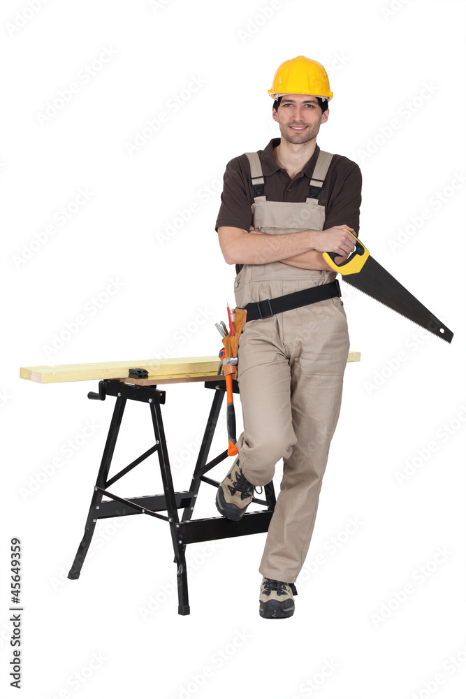 Carpenter with a saw and workbench Carpenter with a saw and workbench
