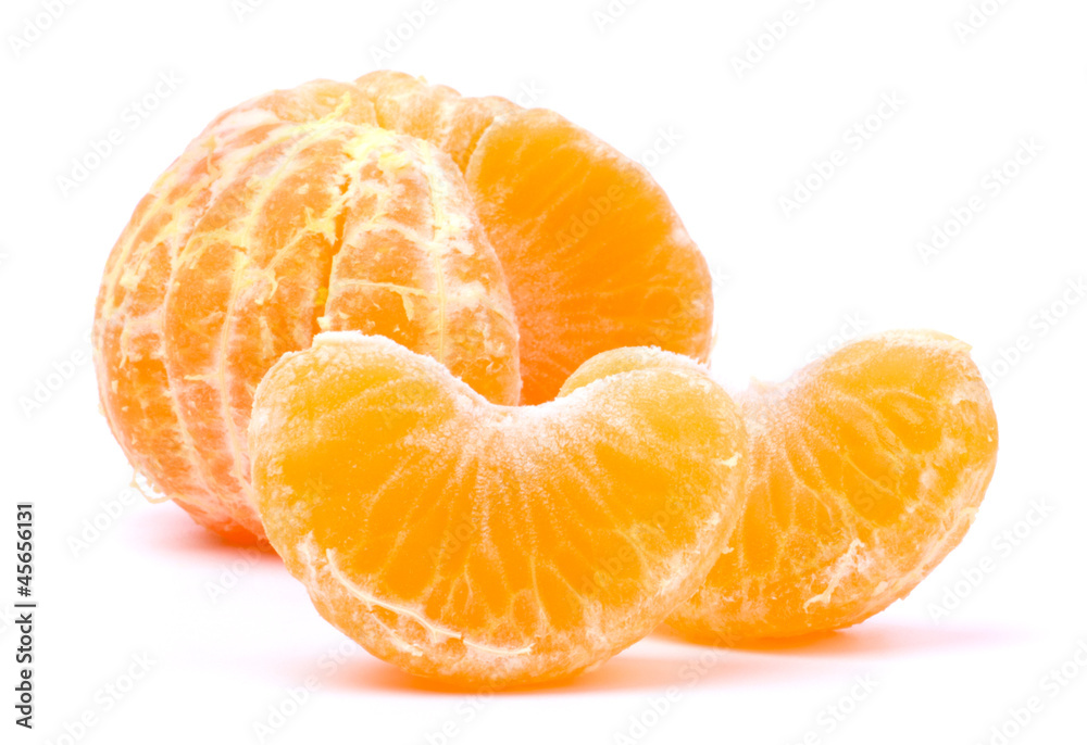 Peeled slices of tangerine on white Peeled slices of tangerine on white