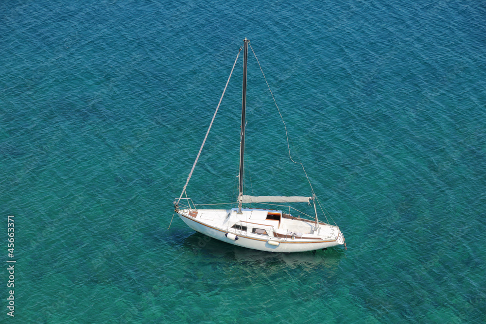 Boat in a quiet bay on Adriatic sea, from above
