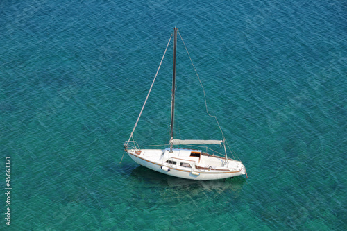 Boat in a quiet bay on Adriatic sea, from above