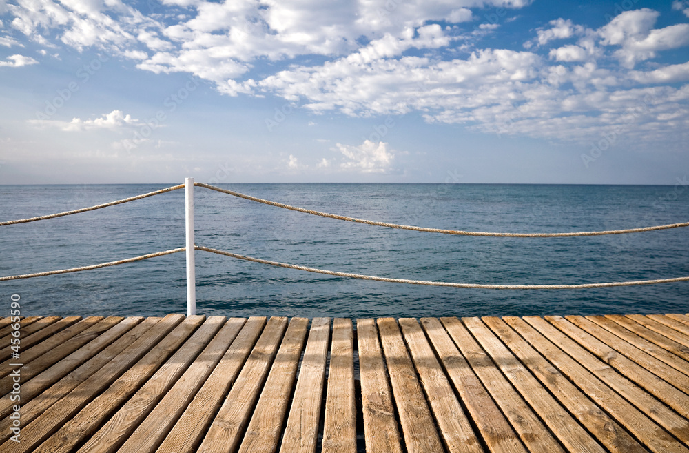 Obraz premium Wooden pier with railings. Mediterranean sea, Alanya, Turkey