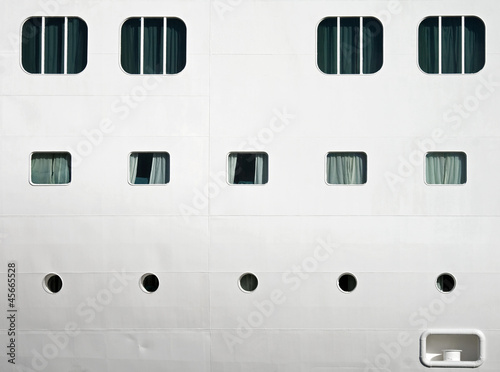 Background texture photo of white ships hull with windows