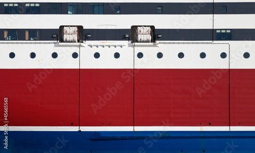 Fotografie Background texture of red ship's hull with waterline