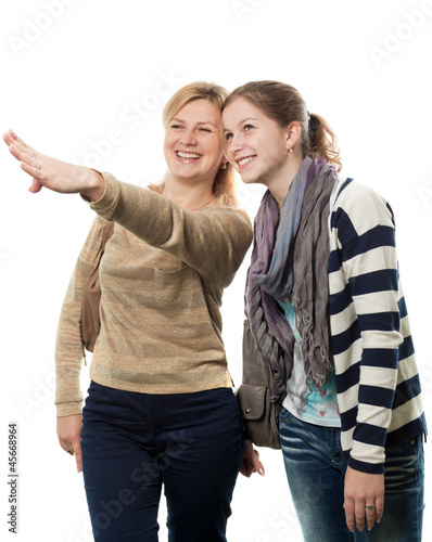 The adult woman shows the girl
