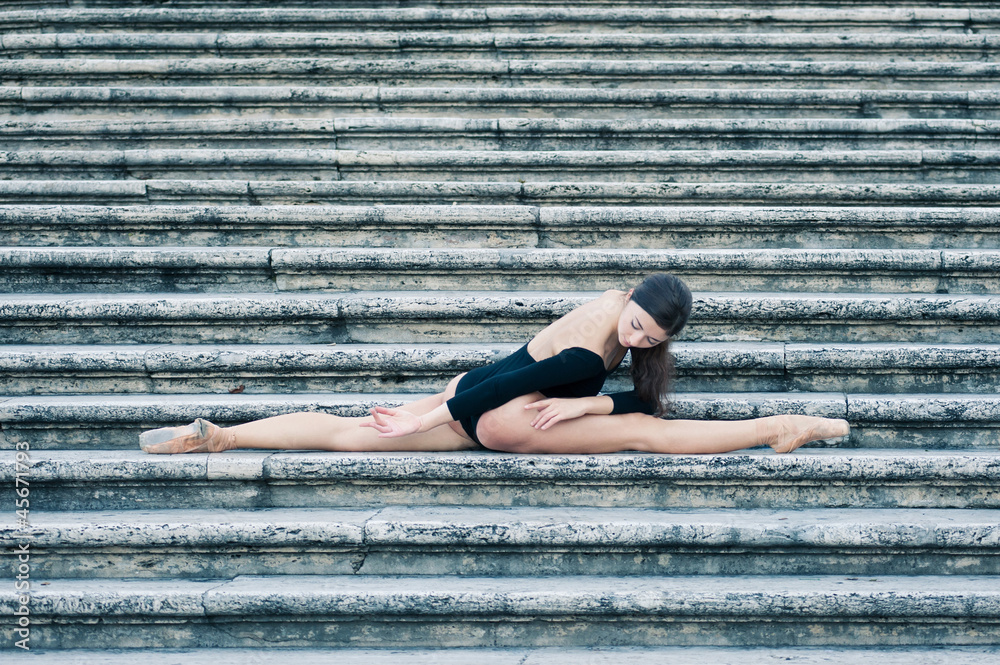 Young beautiful ballerina posing on the Spanish Steps in Rome.