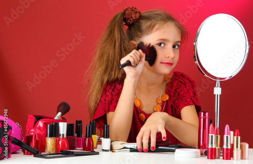 little girl in her mother's...