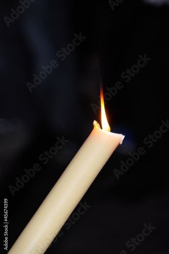 Lighted candle in Holy Week Malaga photo