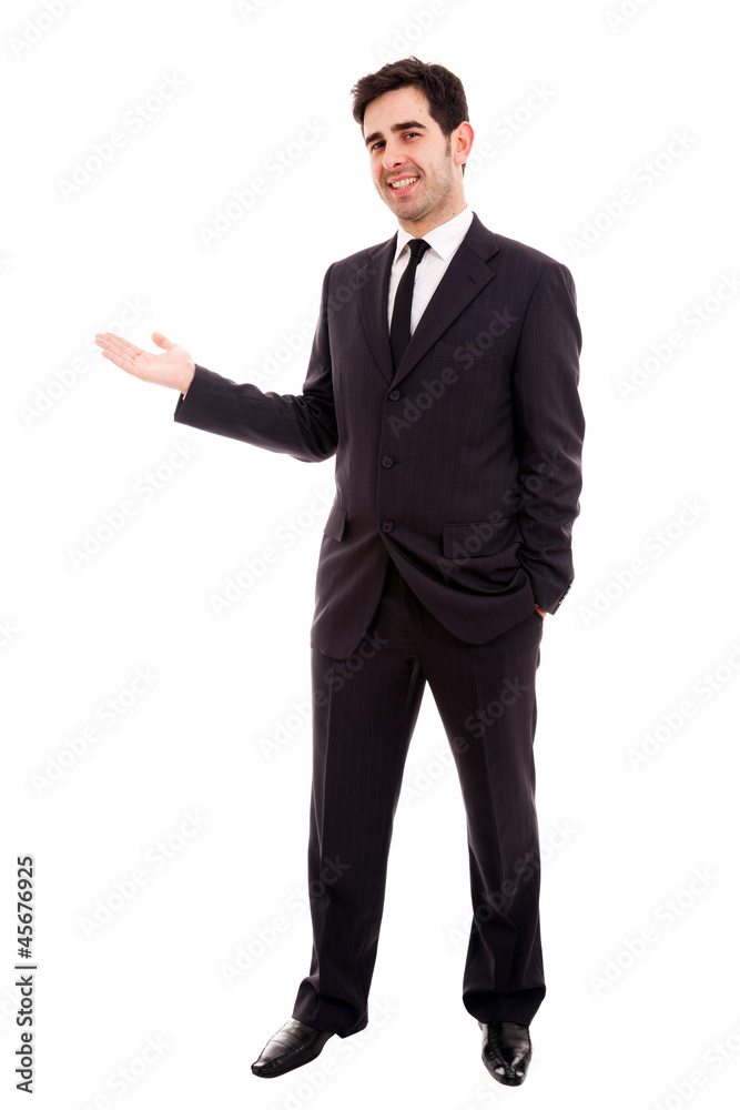 Young business man presenting over white background Young business man presenting over white background