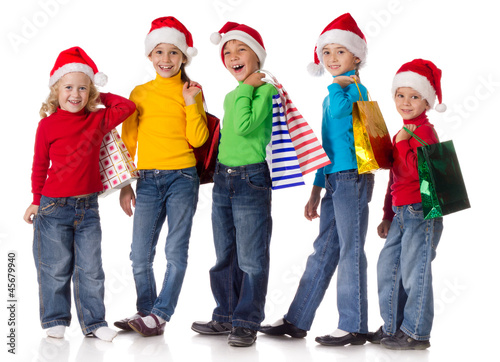 Group of happy kids with christmas gifts