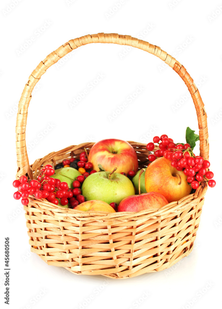 crop of berries and fruits in a basket isolated on white