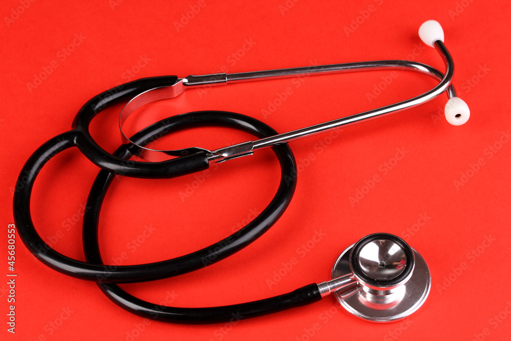 Stethoscope on red background Stethoscope on red background