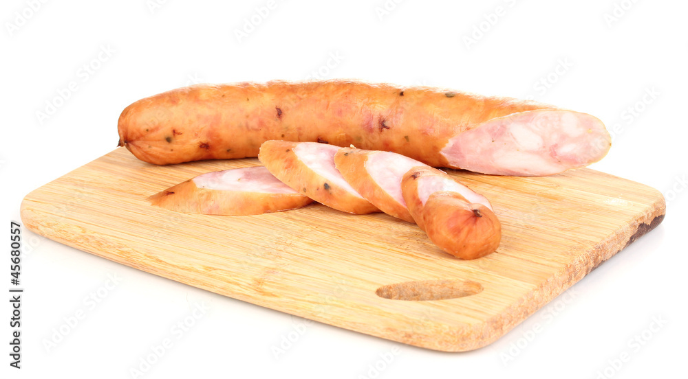 Tasty sausage on chopping board isolated on white Tasty sausage on chopping board isolated on white