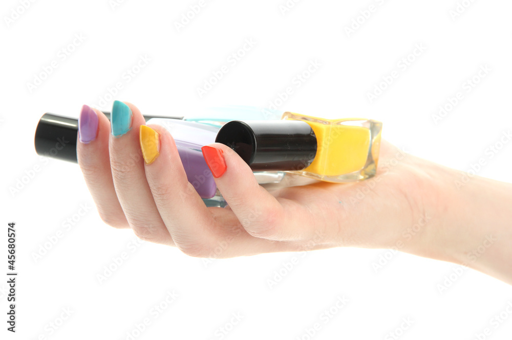 woman hand with nail polishes isolated on white woman hand with nail polishes isolated on white