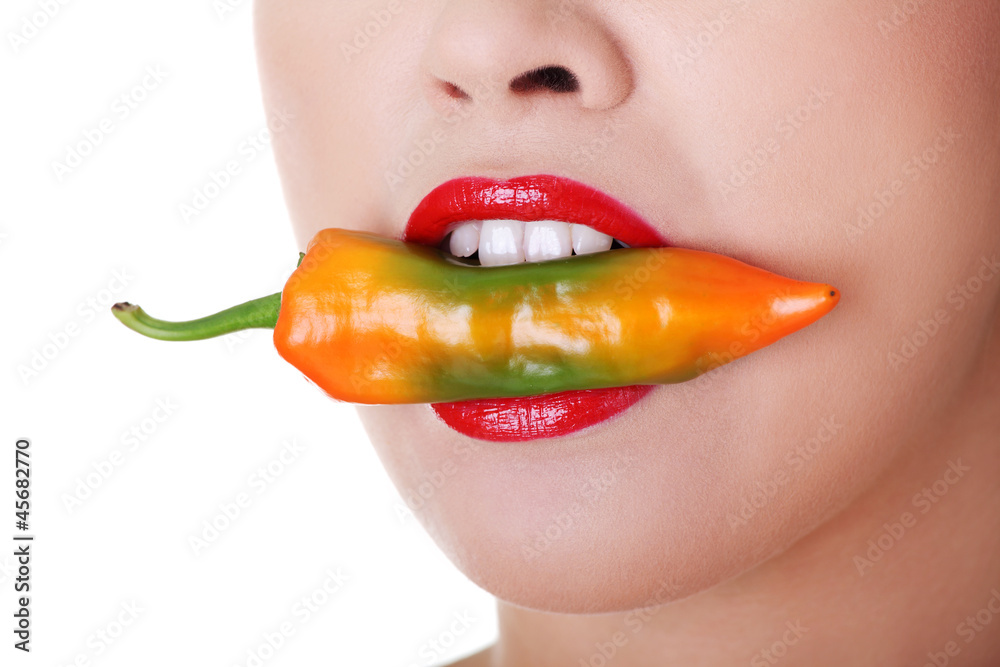 Beautiful woman lips with hot paprika