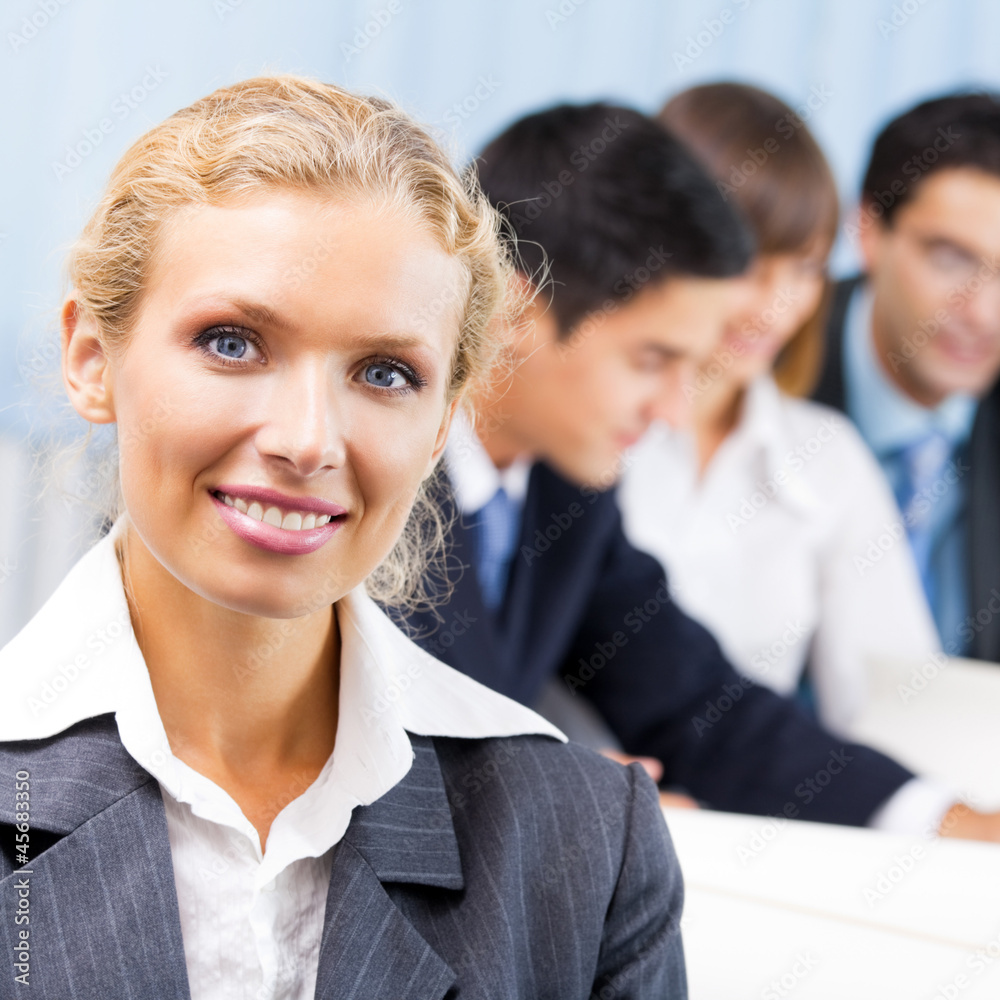 Portrait of happy smiling businesswoman at office Portrait of happy smiling businesswoman at office