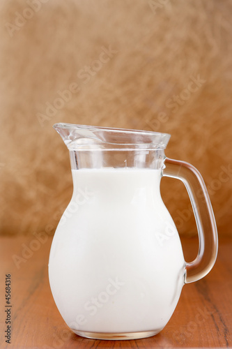 Glass jug of milk