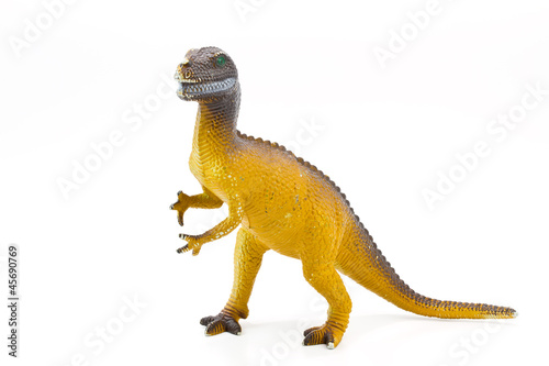 Toy plastic dinosaur on white baclground