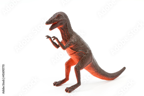 Toy plastic dinosaur on white baclground