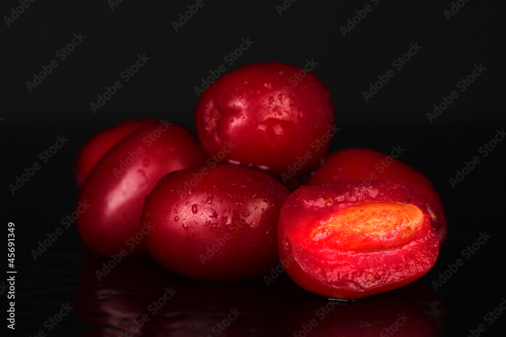 fresh cornel berries isolated on black