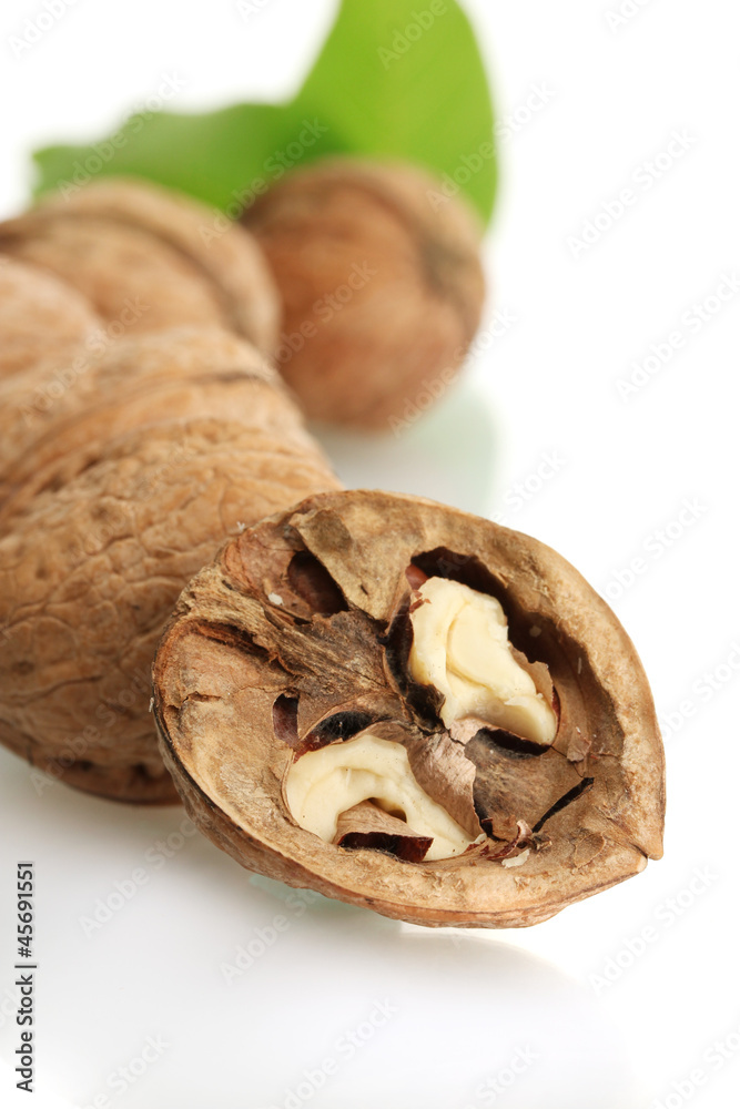 walnuts with green leaves, isolated on white walnuts with green leaves, isolated on white