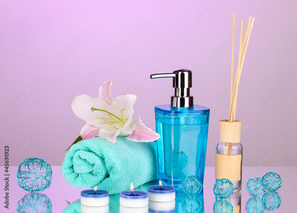 Beautiful spa setting on purple background with reflection Beautiful spa setting on purple background with reflection