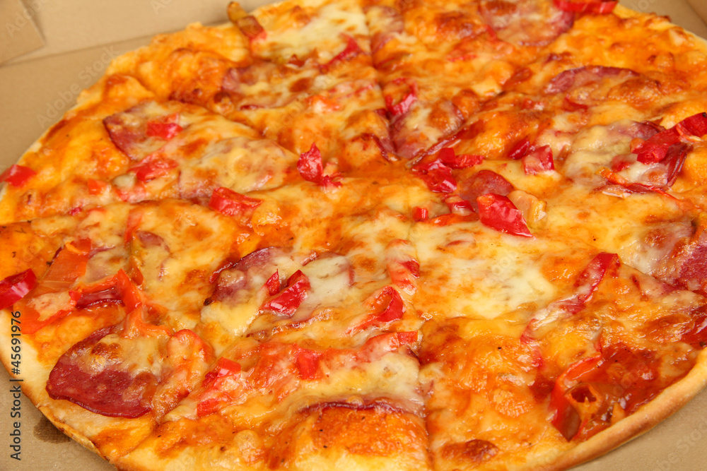 Tasty pizza in box close-up Tasty pizza in box close-up