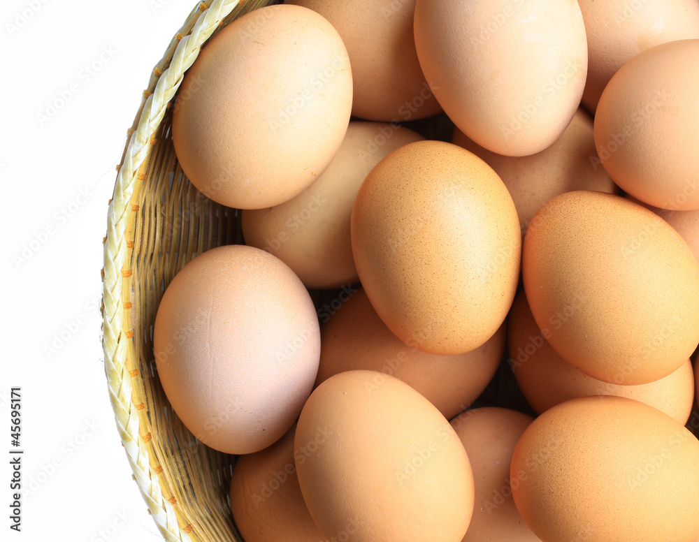 Eggs in basket isolated on white white background Eggs in basket isolated on white white background
