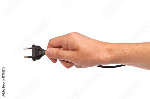 Man is holding a black outlet in the hand