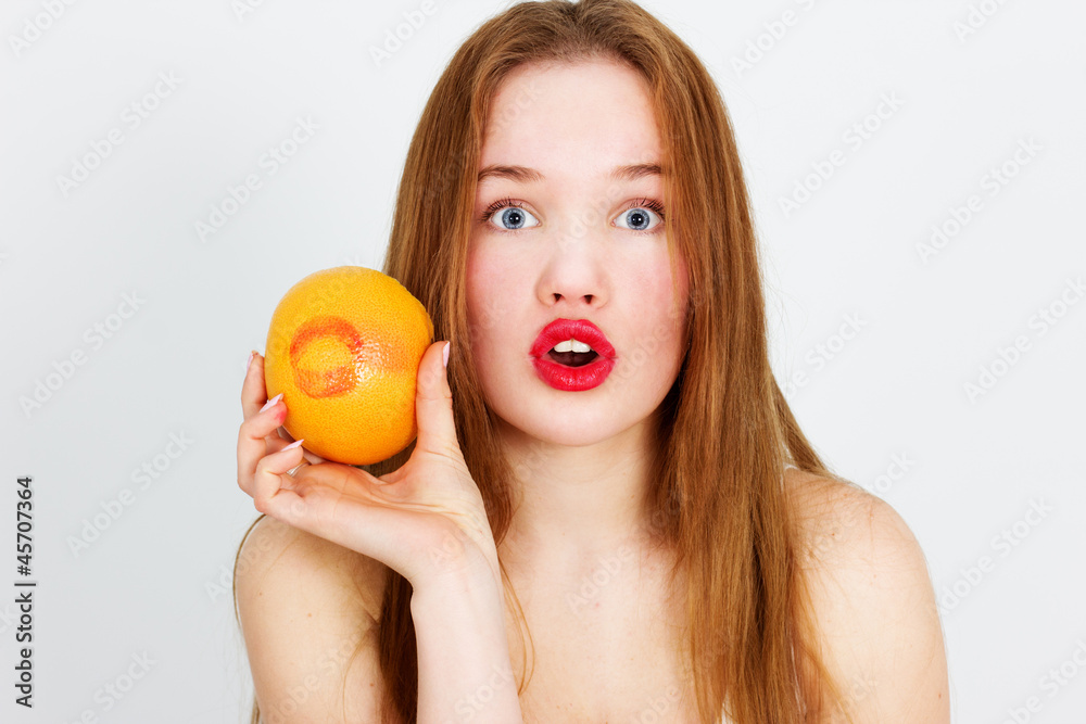 Portrait of young beautiful woman with red grapefruit Portrait of young beautiful woman with red grapefruit