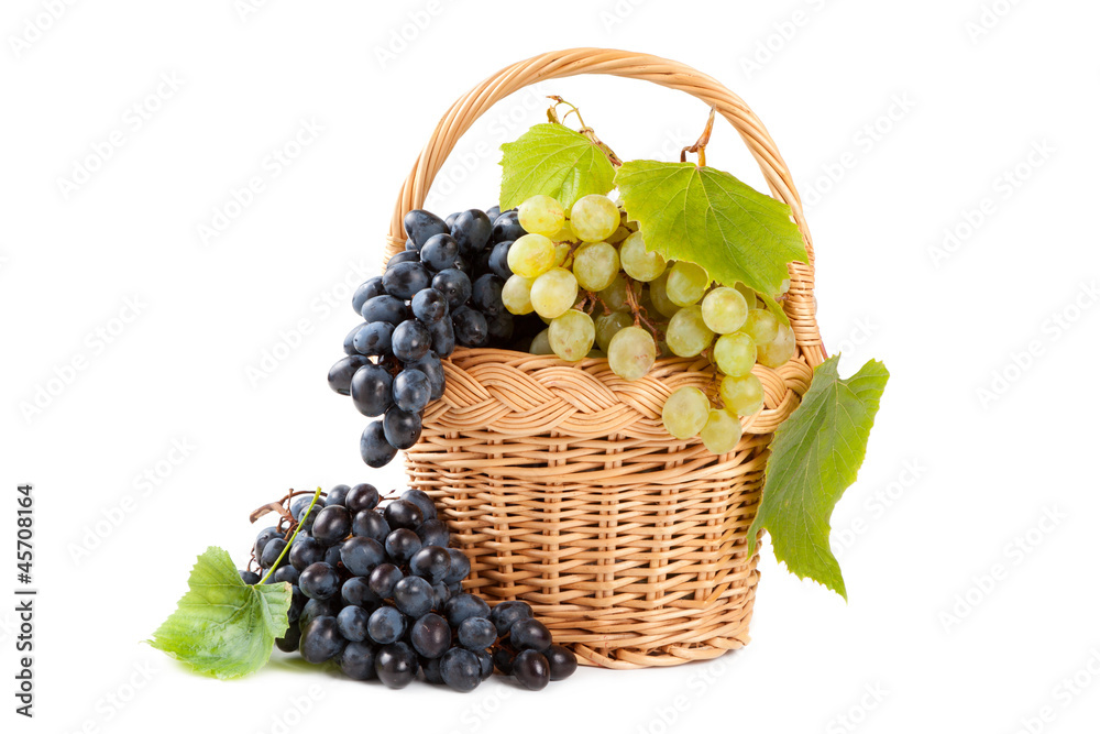 grapes in basket with vine leaves grapes in basket with vine leaves