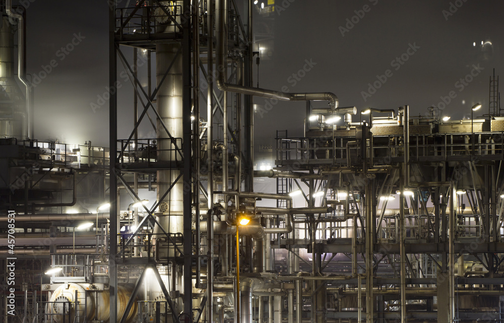 Close-up of an oil-refinery plant at night