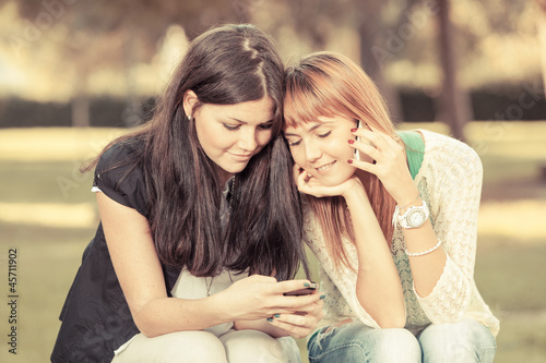 Two Young Women with Mobile Phone © william87