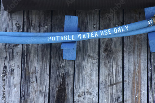 Blue Potable Water Hose on Pier