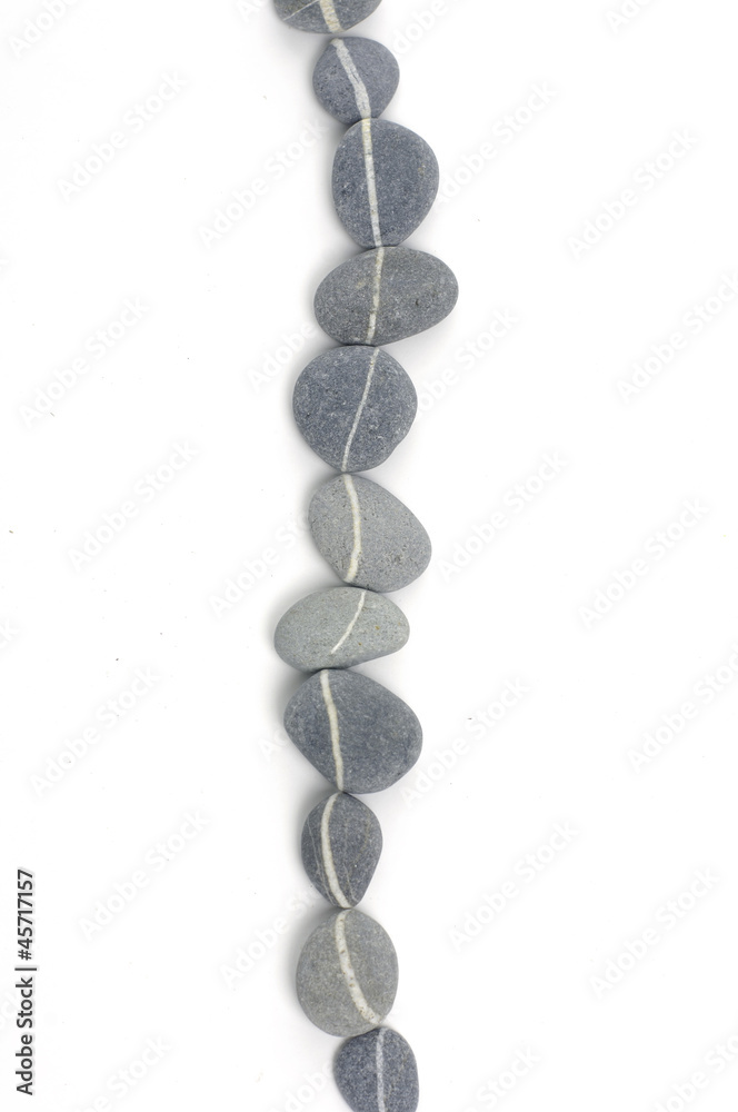 A row of line striped stones A row of line striped stones
