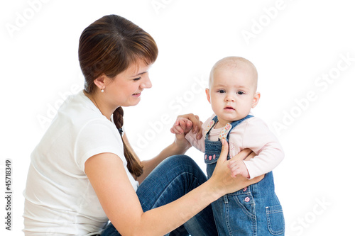 Loving mother playing with ...