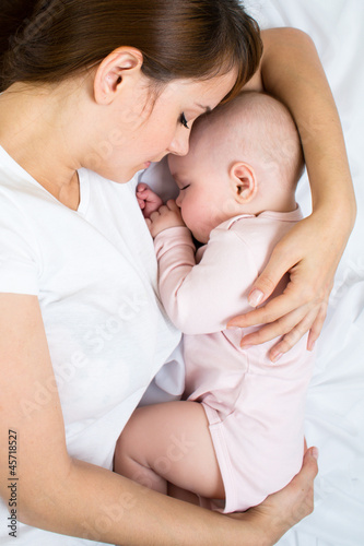 Young mother and her baby s...