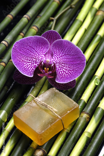 Handmade natural Soap with beautiful orchid on thin bamboo grove