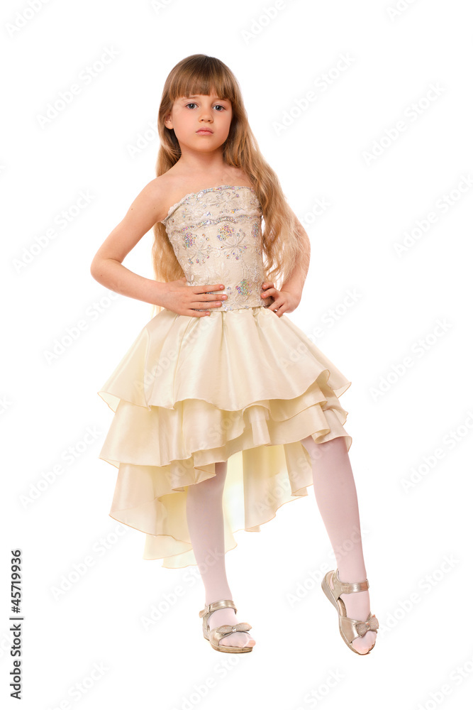 Pretty little girl in a beige dress Pretty little girl in a beige dress