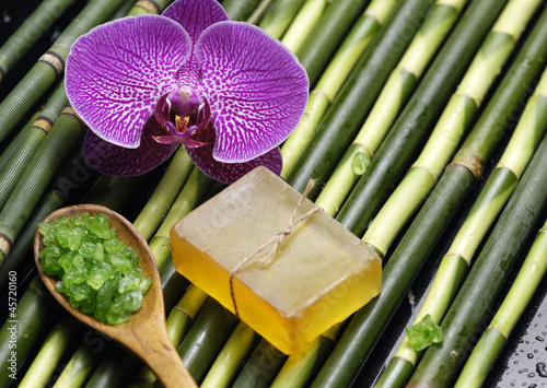 orchid and saltin spoon and soap on  bamboomat