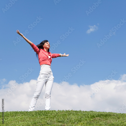 happy young woman dreams to fly on winds