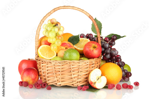 Assortment of exotic fruits in basket, isolated on white
