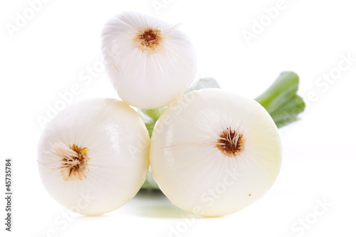 three peeled green onions